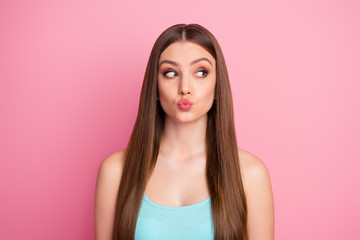 Close-up portrait of her she nice attractive lovely lovable winsome curious cheerful cheery straight-haired girl sending air kiss looking aside isolated over pink pastel color background