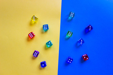 colored  dices showing number six on colored background. Free copy space. Concept of game, winning combination. Colored playing cubes. Top view