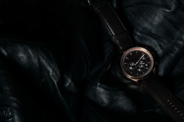 Gold LEATHER WATCH, VINTAGE STYLE WRIST WATCH, MEN'S LEATHER WATCH on leather background blur.