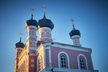 Old church on warm winter landscape of sunset blue sky