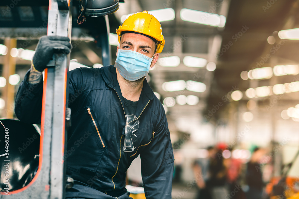 Worker wear disposable face mask for protection Corona Virus Spreading and Smoke dust air pollution filter in factory for healthy labor care. - obrazy, fototapety, plakaty 