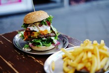 Close-up Of Large Hamburger On Table
