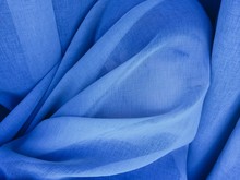 Close-up Of Woman Covered In Blue Fabric