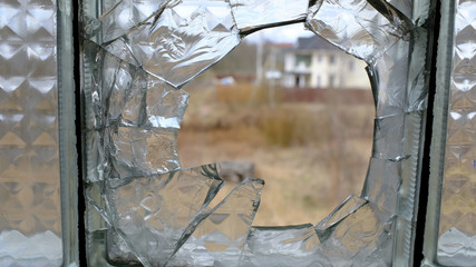 Poster - broken window in the house.