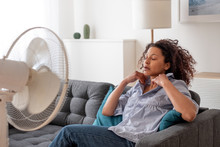 Black Woman At Home Refreshing During Summer Haze
