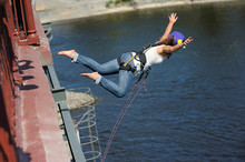 Rope Jumping. Girl In Helmet Starting To Jump From A Bridge