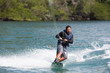 © Luis Garcia - Latino man wake boarding in Costa Rica.
