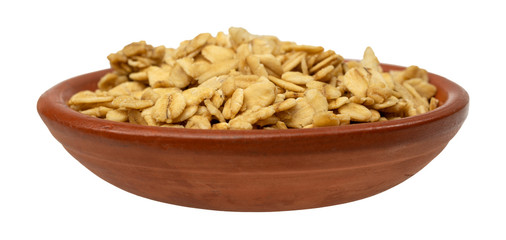 Wall Mural - Side view of a bowl filled with brown sugar oat granola