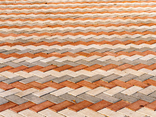 Orange tile on street. Tile background