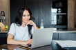 © LIGHTFIELD STUDIOS - beautiful woman working with laptop and business documents on kitchen on self isolation