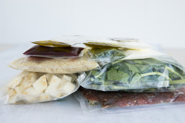 set of products for dinner: minced meat, rice, spinach, celery, dill, olive oil, sauces and spices. Set for delivery of food for dinner on a light background. Cooking at home, home-cooked food.