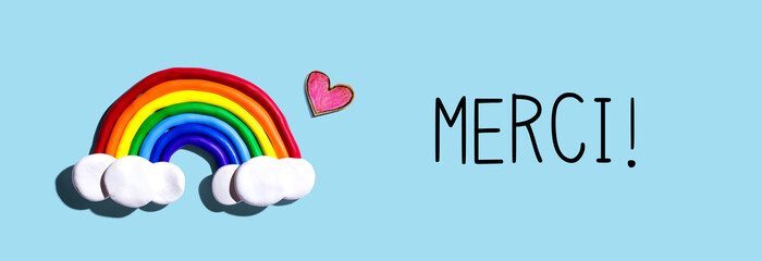 Poster - Merci - Thank you in french language with a rainbow and a heart