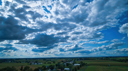 Wall Mural - Blue sky and multiple clouds background showing a horizon