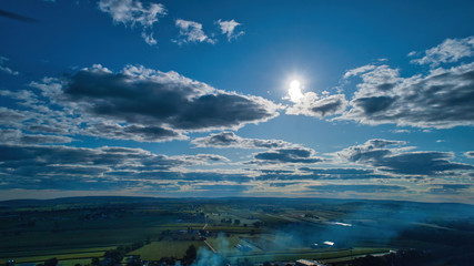 Wall Mural - Blue sky and multiple clouds background showing a horizon