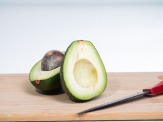 healthy food. fresh cut avocado on a wooden Board