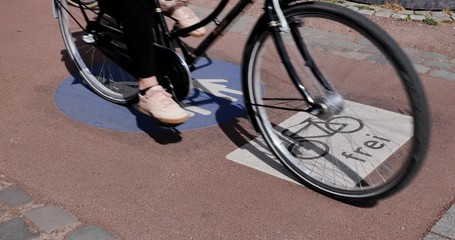 Wall Mural - Selected focus view at bicycle with FREI means Free and people symbol on pedestrian and bicycle lane with cyclist ride bicycle in Germany Cycling friendly city in Ecityurope. 