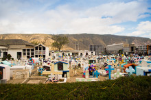 QUITO, ECUADOR- MAY 23, 2017: View Of Cemetery San Antonio De Pichincha, Showing Typical Catholic Graves With Large Gravestones, Mountain Background