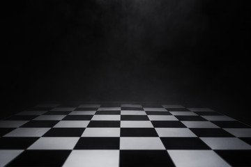 empty chess board with smoke float up on dark background