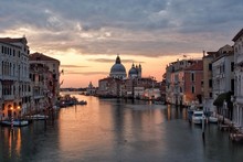Grand Canal By Santa Maria Della Salute Against Cloudy Sky During Sunset