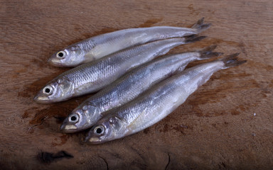 Wall Mural - Smelt fish on cutting board