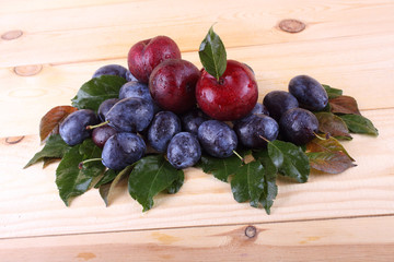 Wall Mural - Different color plums on table