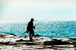 【シルエット】岩場での釣り風景