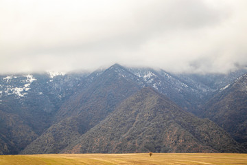 Armenia. Mountain peaks in the clouds. Beautiful panorama of the triangular mountains.