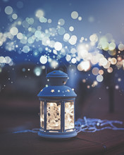 Lantern Of White Lights With Bokeh Effect During The Blue Hour