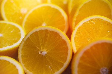 Sliced yellow juicy lemons background