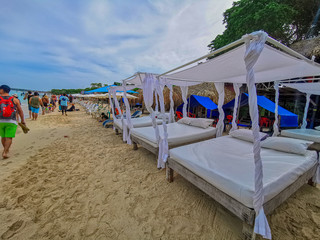 BARU, CARTAGENA, COLOMBIA - NOVEMBER 09, 2019: View on paradise beach with tourists of Playa Blanca on Island Baru by Cartagena in Colombia.