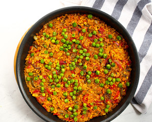 Wall Mural - Vegan Paella with red peppers and green beans. 