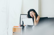 © panitan - serious people frustrated exhausted work stress concept.asian woman holding hands on face feeling tired suffering working job in work place.concept global economic and health problems