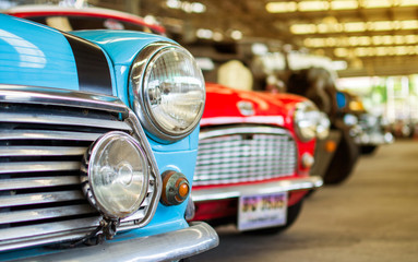 Close-up of the blue and red vintage car headlights in Jesada Millennium, Nakhon Pathom, Thailand, 02/03/2020.