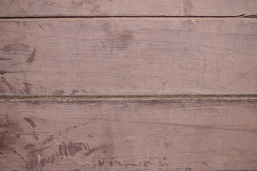 The old plank flooring has been used until it has survived, scratched and cracked.