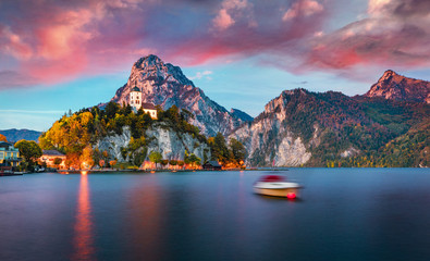 Splendid sunset view of Johannesbergkapelle church. Fantastic evening scene of Traunsee lake. Colorful autumn landscape of Austrian Alps with Traunstein peak on background, Austria, Europe.