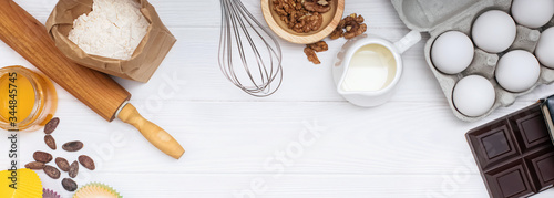 Fotografía Ingredients and utensil for baking on white background