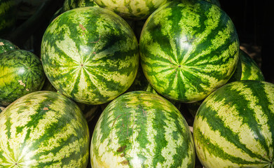 Fresh organic whole green watermelons on the local market