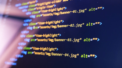 screen of web developing code on dark background.