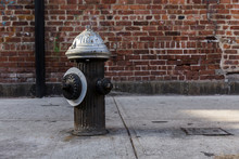 American Fire Hydrant, In The Middle Of A New York Street, The Back Wall Is Brick