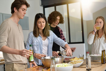 Flatmates cooking together at home