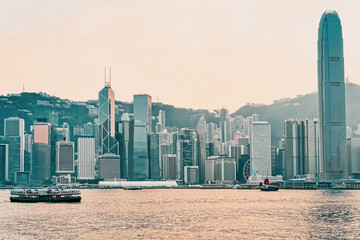 Wall Mural - Star ferry in Victoria Harbor in Hong Kong at sundown