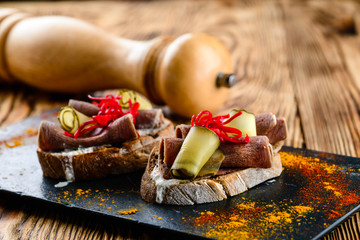 Wall Mural - set of different bruschetta with tongue and cucumber