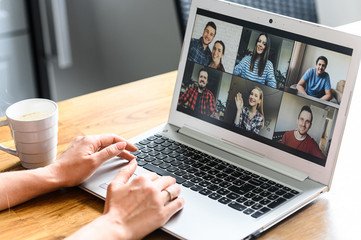 Video call, zoom. Icons of a group of people on laptop screen, app for video online communication. Female hands on the keyboard