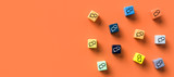 Fototapeta Mapy - many cubes with speech bubble icons on orange background