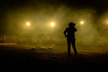 Rodeo Workers From Brazil. Announcer Calls To The Crowd During Rodeo Show At An Arena In Brazil.
