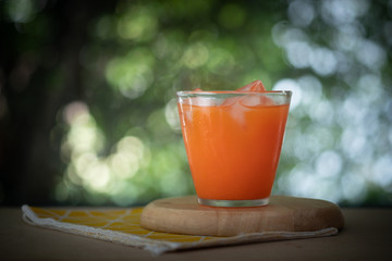 Wall Mural - Fresh carrot juice in glass with ice