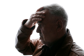 Old man holds his head. Aged male feeling sick, having headache.