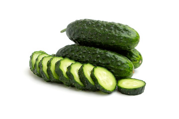 Wall Mural - Bright green cucumbers sliced and whole isolated on a white background 