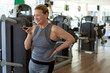 © Clique Images/Stocksy - Senior Woman Using Voice Helper In Gym