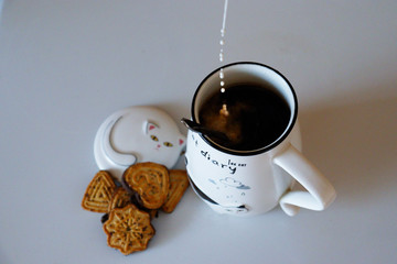 cup of coffee and cookies